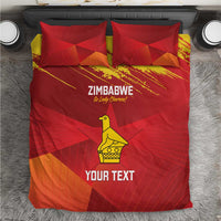 Red bedding set with Zimbabwe text, yellow bird graphic, and 2 matching pillows
