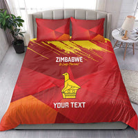 Red bedding set with Zimbabwe text, yellow bird graphic, and chevron grunge pattern