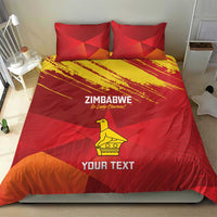Red duvet and pillow set with Zimbabwe text, yellow bird icon, and chevron grunge design