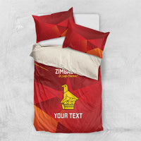 Red bedding set with Zimbabwe text, yellow bird graphic, and orange chevron accents