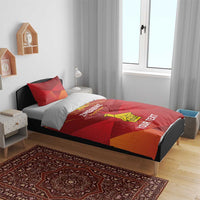 Red bedding set with Zimbabwe text and yellow bird graphic on duvet and pillows