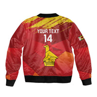 Red cricket bomber jacket with black ribbed collar and cuffs, back parrot graphic, '14'