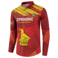 Red cricket pullover with yellow chevron print, Zimbabwe text and crest, long sleeves