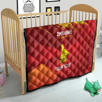Custom Zimbabwe cricket quilt in crib, red with yellow bird and 'Your Text' panel