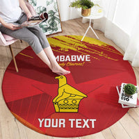Red round carpet with Zimbabwe chevrons, yellow bird icon and 'YOUR TEXT' across bottom.