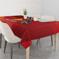 Red tablecloth with yellow emblem and custom text, with corners hanging