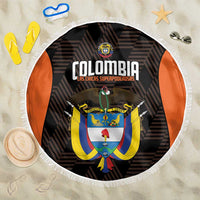 Round black Colombia beach blanket with white fringe and large crest graphic center