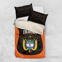Orange and black football bedding set with crest emblem and matching patterned pillowcases