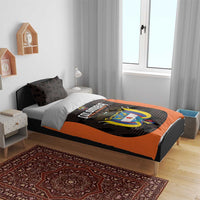 Football bedding set in black and orange, featuring large Colombia crest on duvet
