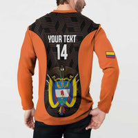 Orange and black football button sweatshirt on model, back 'YOUR TEXT 14' crest