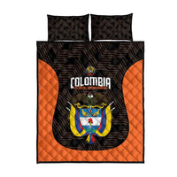 Black quilt bed set with orange side panels, Colombia crest center graphic, two pillows