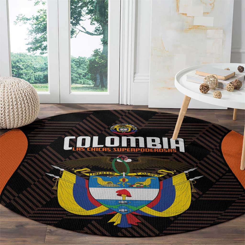 Black round area rug featuring orange side stripes and Colombia logo over geometric pattern