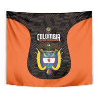 Football team tapestry close-up, Colombia crest centered on orange and black fabric