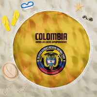 Yellow round beach blanket with white fringe, Colombia crest and team text
