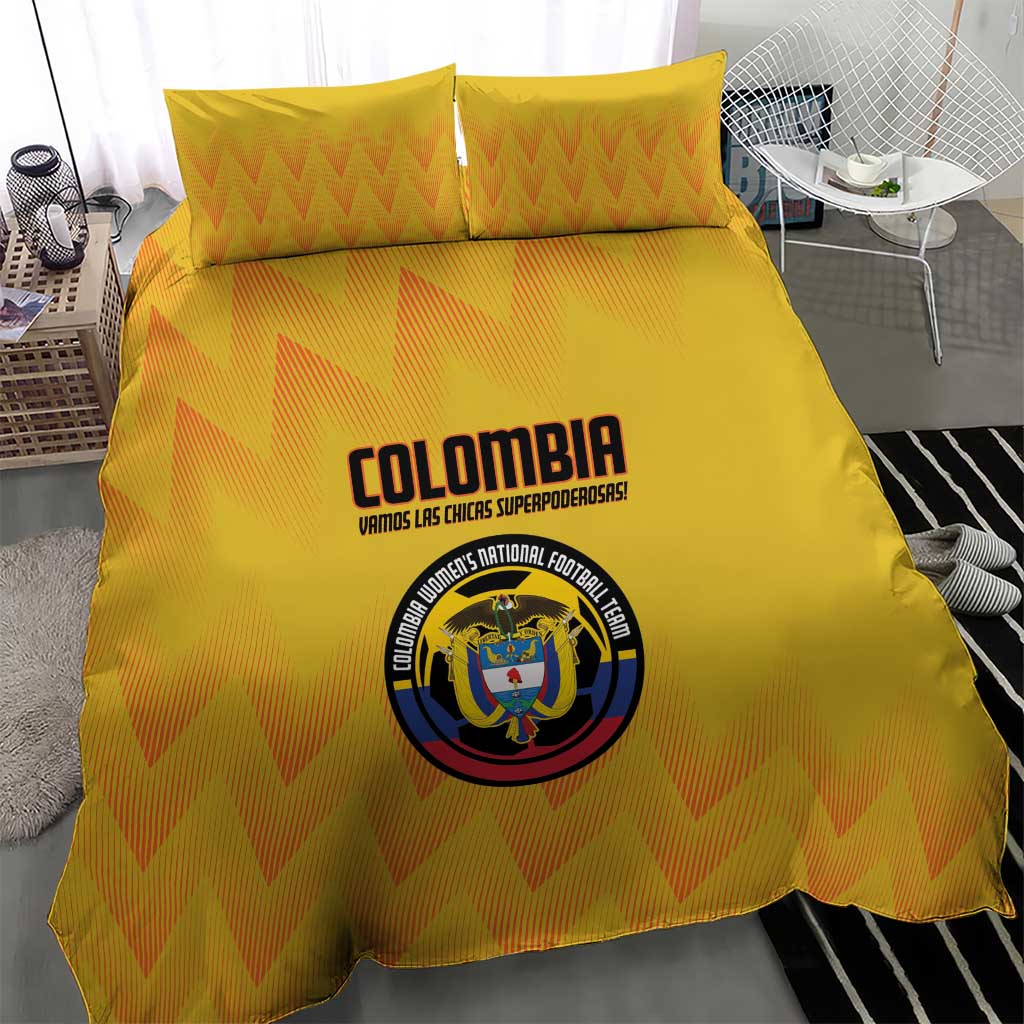 Yellow duvet and pillow set with orange chevron zigzag design and Colombia crest center print.