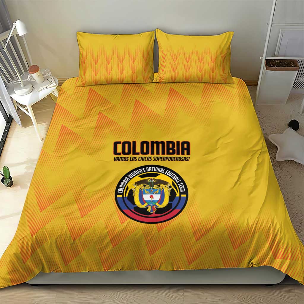 Yellow bedding set with orange zigzag stripes and Colombia crest logo on the duvet front.