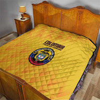 Yellow Colombia football quilt on bed, diamond quilting pattern with crest and Colombia lettering