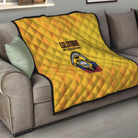 Yellow Colombia football quilt on sofa, quilted diamonds with Colombia crest and logo