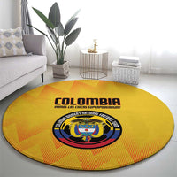 Yellow round Colombia football carpet with crest emblem and printed text around edge.
