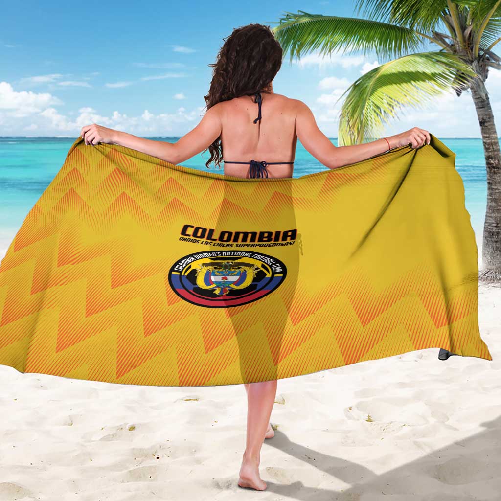 Yellow Colombia football sarong with zigzag pattern and crest logo, held open