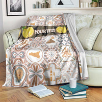 Personalized Sicilia mosaic motif blanket with custom “YOUR TEXT” band, on couch