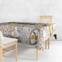 Cream tablecloth with Sicilian mosaic symbols and colorful abstract tiles, corner overhang