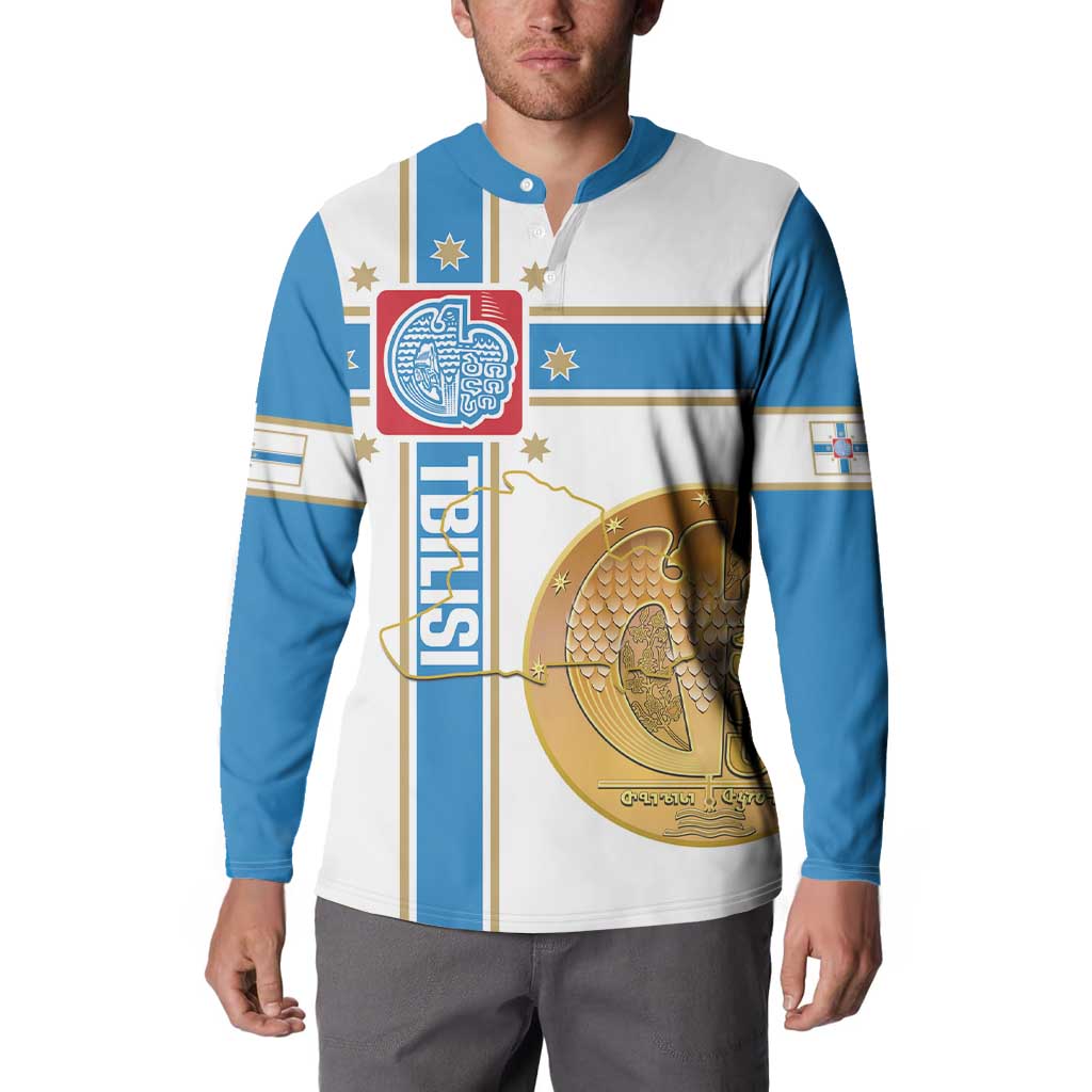 Men's button sweatshirt worn by model; white and blue flag-style emblem and bird print