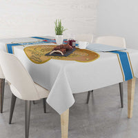 White tablecloth corner with blue trim and gold emblem design