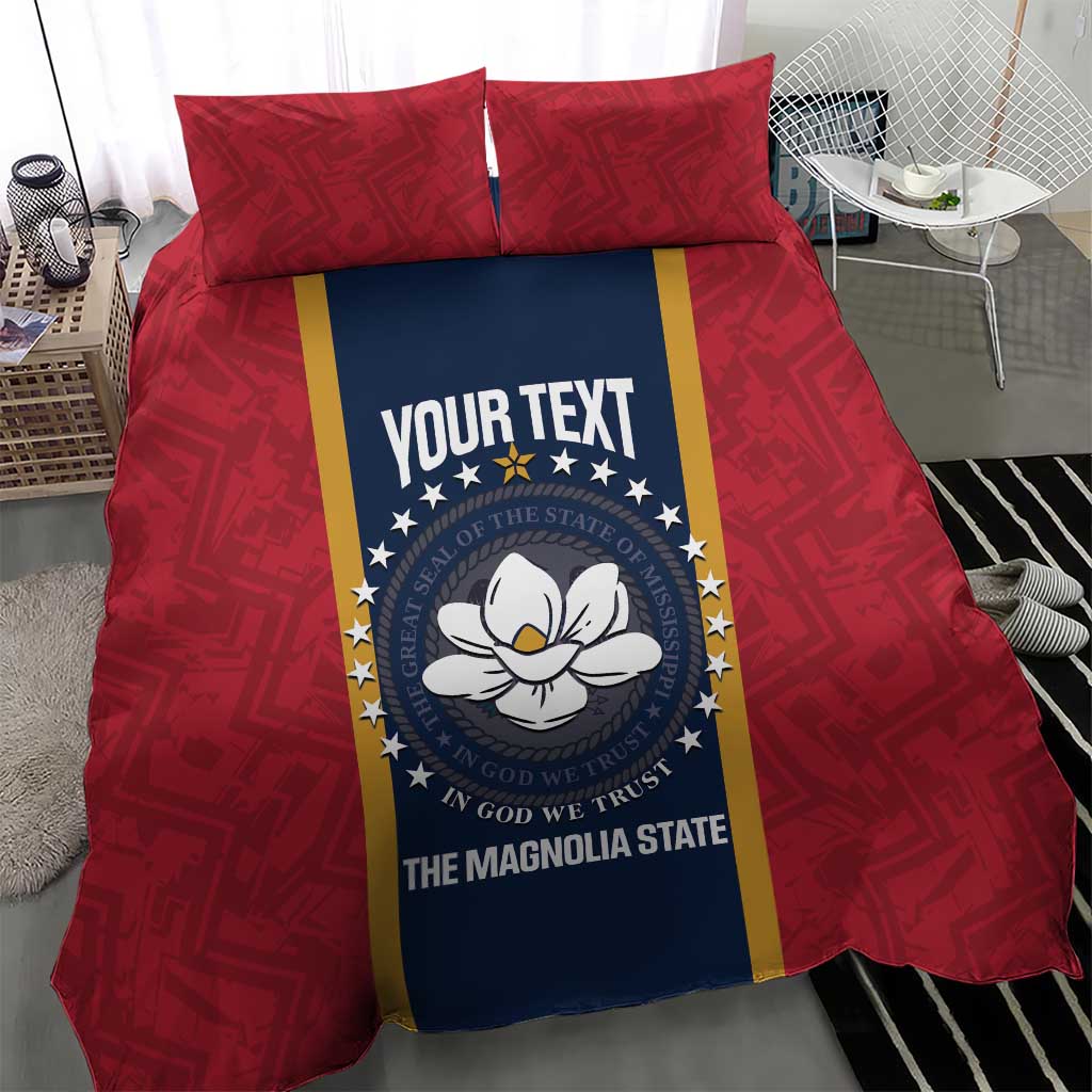 Red duvet cover set with two pillows and central blue emblem panel reading “The Magnolia State”