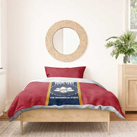 Red duvet and pillow set with blue emblem panel and gold vertical stripe detail