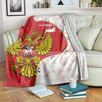 Red and white Russia crest blanket with map and winged emblem, draped over couch