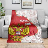 Russia-themed red and white blanket with large crest and map, spread across sofa