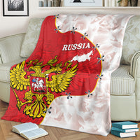 Red and white Russia crest blanket with map, draped over armchair cushion