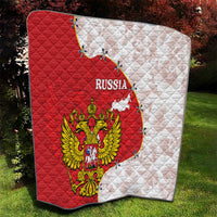 Red-and-white Russia quilt with quilted diamond pattern, map shape, and eagle emblem