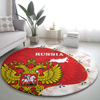 Red round Russia carpet rug with RUSSIA lettering, golden eagle wings, and coat shield