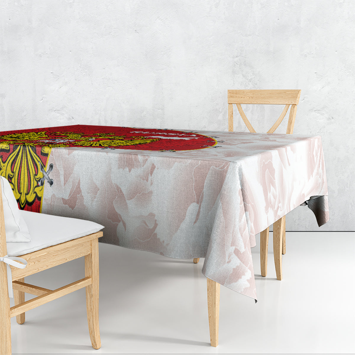 Red and white map-print tablecloth with coat of arms detail on corner