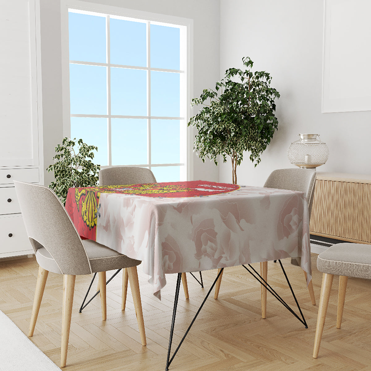 Red and white tablecloth with crest and map print on dining table