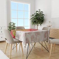 Red and white tablecloth with crest and map print on dining table
