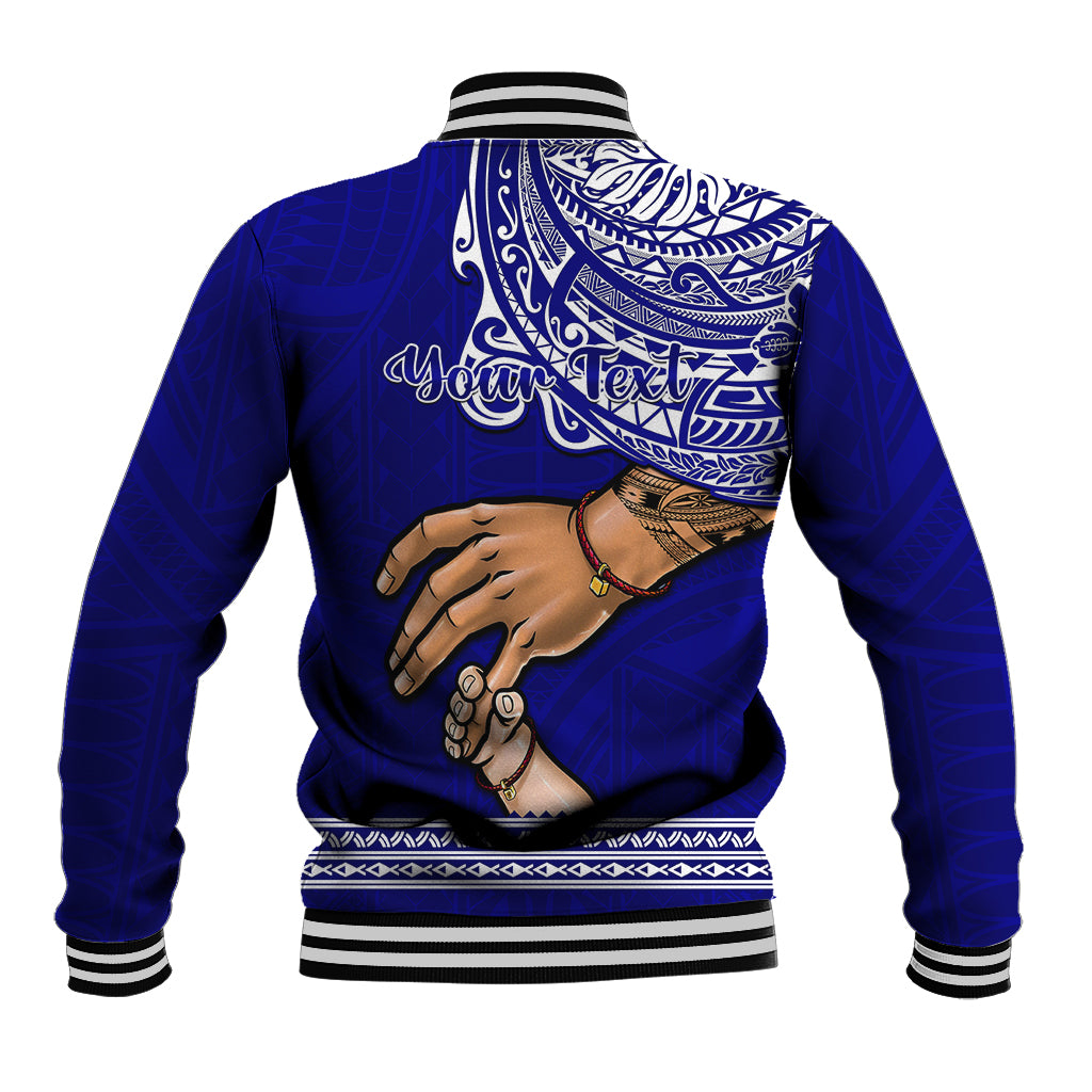 Blue baseball jacket with striped collar, large back graphic of hands and tribal pattern.