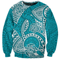 Turquoise crewneck sweatshirt with white honu and Polynesian tribal print, long sleeves