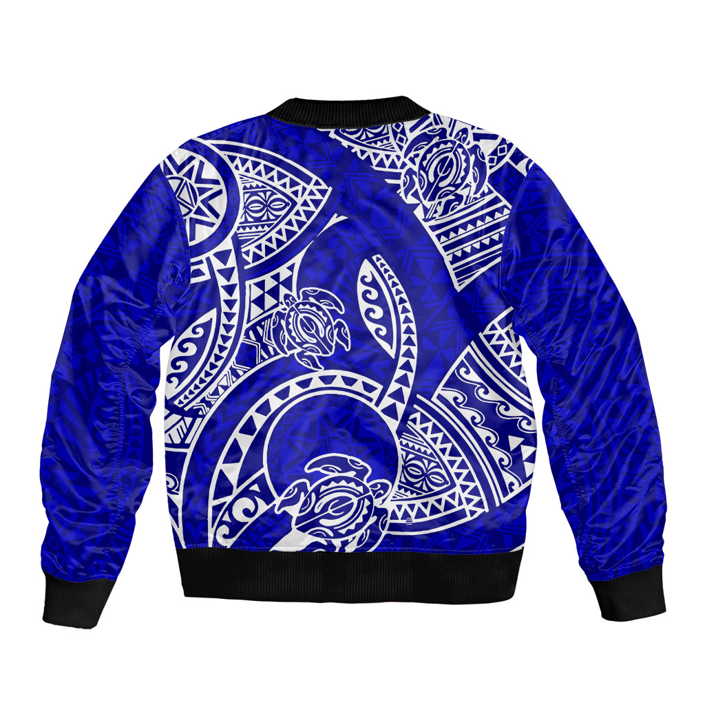 Blue bomber jacket with large back Polynesian tribal honu graphic and ribbed hem