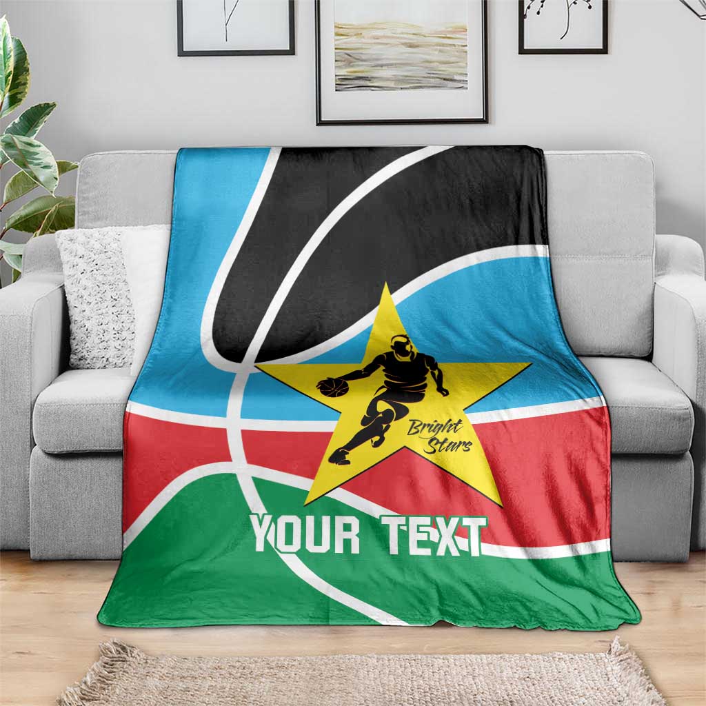Custom basketball blanket draped on sofa, black/blue/green/red with yellow star and 'Your Text'