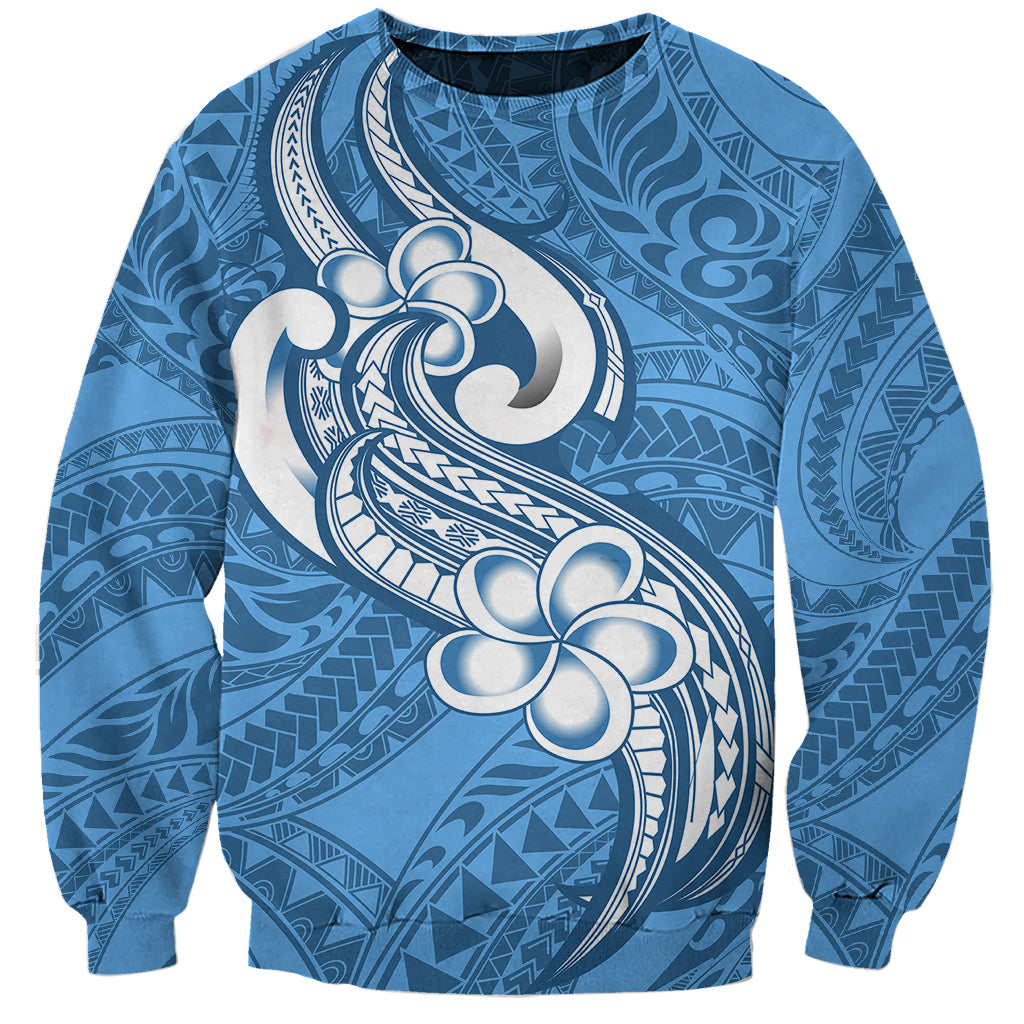 Unisex blue sweatshirt with white tribal plumeria print, crew neck and ribbed cuffs
