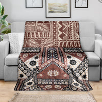 Brown tapa-pattern throw blanket with black and white floral and geometric details