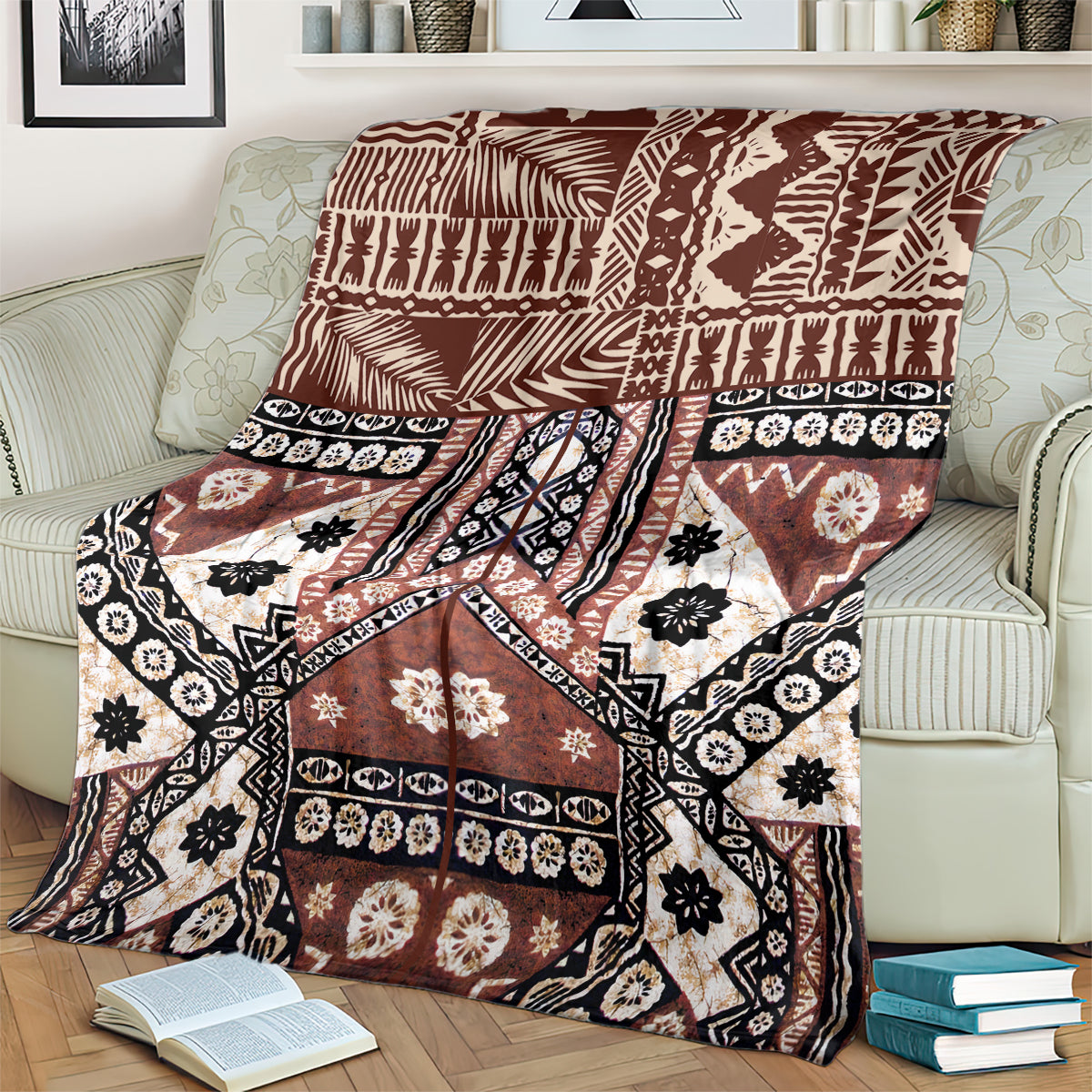 Brown and black tapa-pattern blanket with white flower and star-like motifs