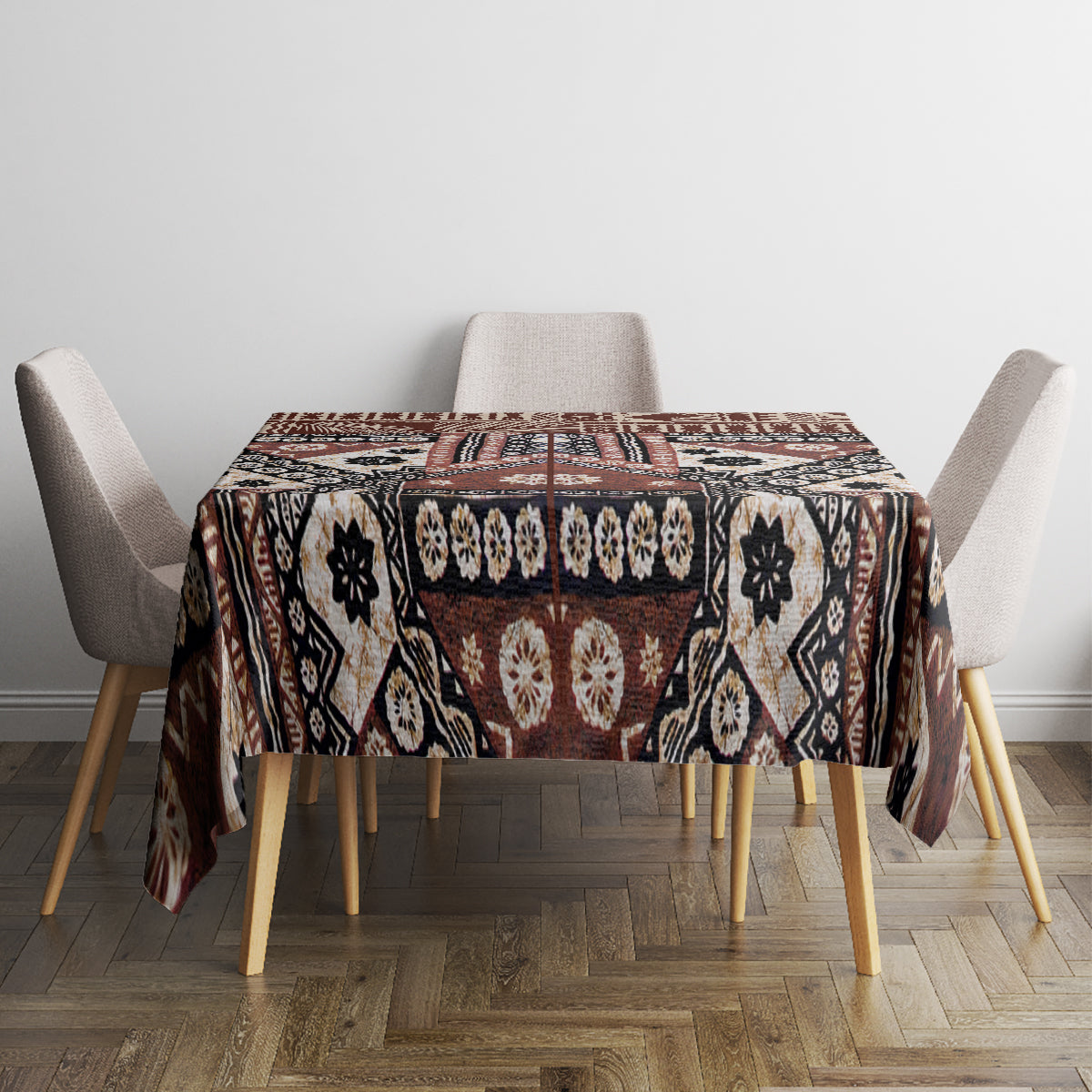 Brown tapa-inspired tablecloth featuring black, cream, and rust panel motifs.
