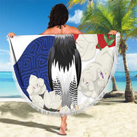 Beach blanket held up: round Panama flag design with harpy eagle and floral Mola pattern, fringe