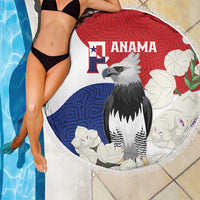 Round beach blanket on poolside with Panama flag, harpy eagle and floral Mola-style print, fringe