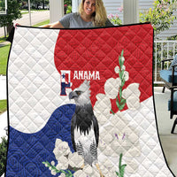 Flag-style quilt with white, red, and blue panels; harpy eagle and floral mola design