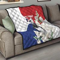 Flag-style quilt on living-room sofa, white, red, and blue; harpy eagle and floral vines